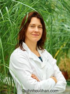 Dr Liz Rylott, standing in front of some tall grasses